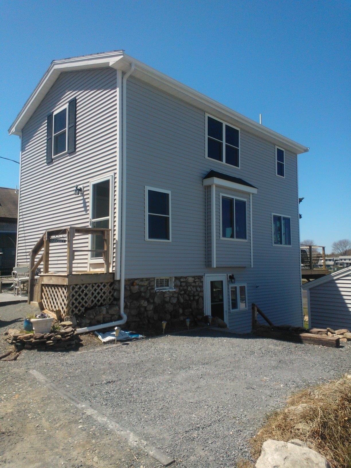 After photo of the completed full second-story addition and remodeled exterior by Boston J's