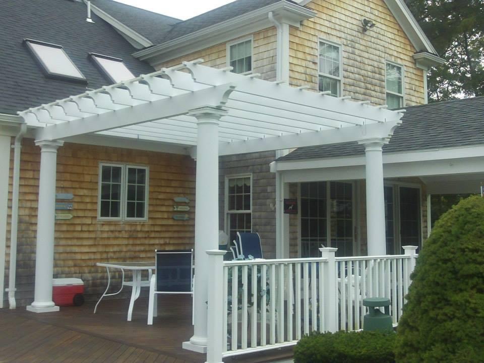 Completed white poolside pergola built by Boston J's Roofing and Construction
