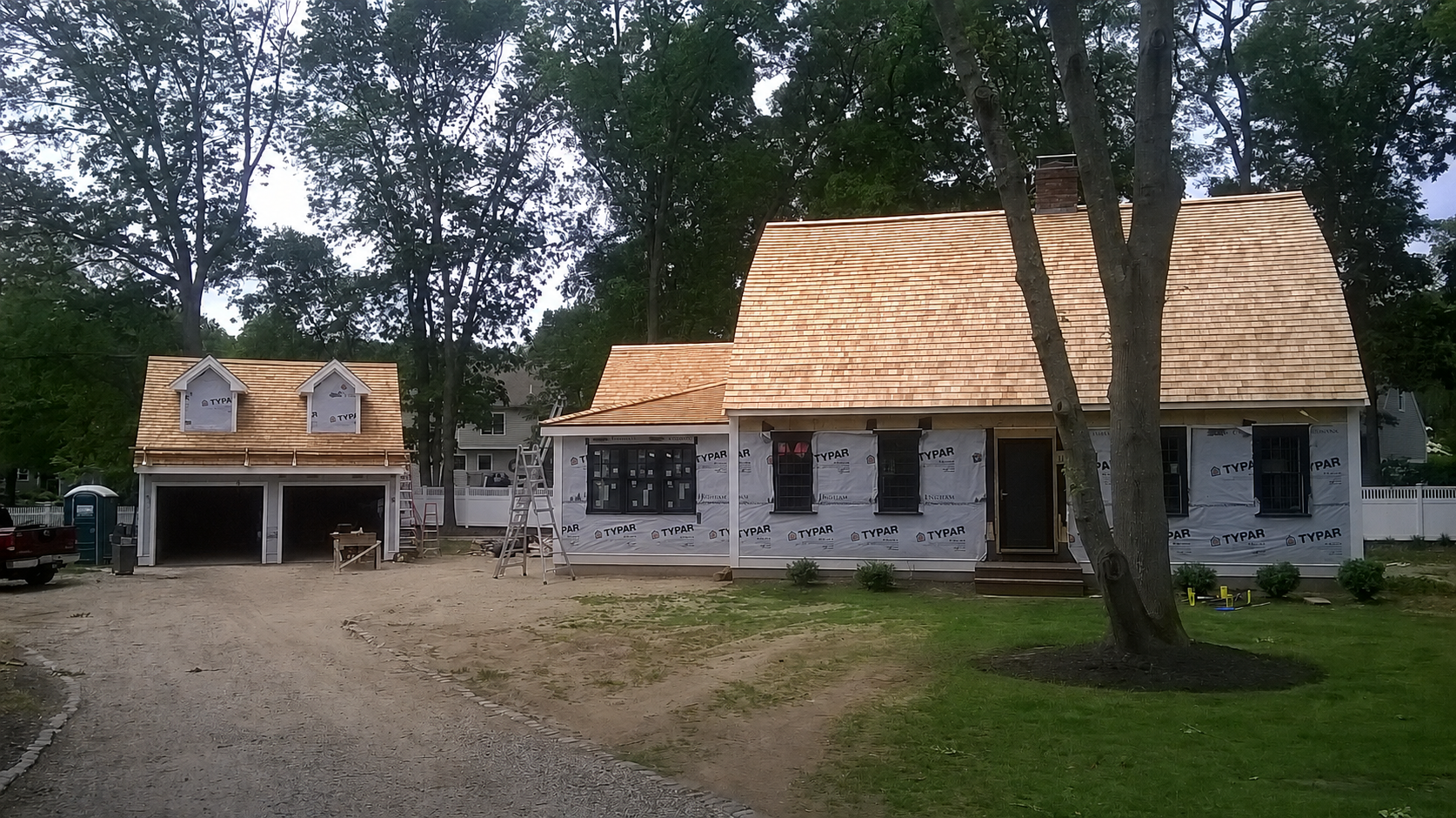 Cedar wood shingle roof installed by Boston J's Roofing & Construction on a South Shore Massachusetts home