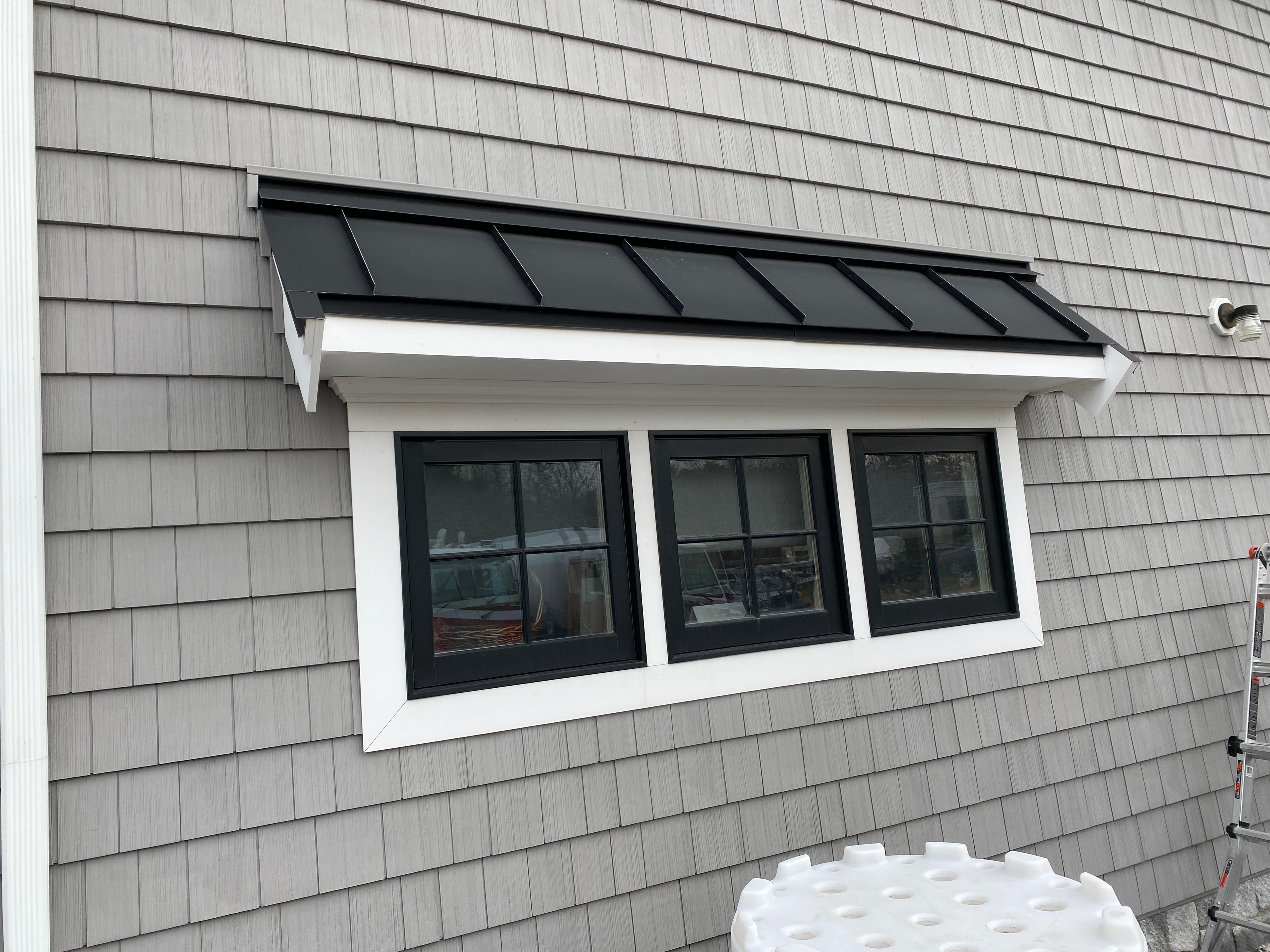 Standing seam metal roofing accent installed by Boston J's Roofing & Construction on a South Shore Massachusetts home